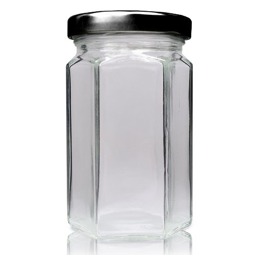 Honeycomb, hexagonal glass jar with black metal lid.